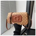 Close-up of vintage khaki plaid crossbody bag with embossed G logo and leather strap - Dark Brown