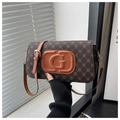Close-up of brown canvas crossbody bag featuring clover patterns and a large G leather patch - Coffee