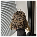 Close-up detail of leopard print corduroy texture and sturdy straps on the mini backpack - Khaki