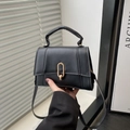 Minimalist black matte leather handbag with gold metal clasp and detachable strap - Black