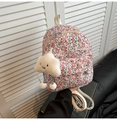 Detail of floral canvas backpack featuring a cute white cloud plush pendant and gold zippers - With Pendant / White with Pink Floral