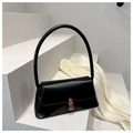 Minimalistische schwarze Baguette-Tasche aus Leder mit hohem Henkel auf Stufen - Schwarz