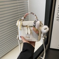 White marble-patterned box bag with decorative silk scarf and plush charm detail - White