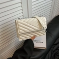 Elegant white quilted crossbody bag with silver chain strap for women in minimalist setting - White