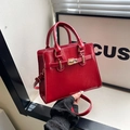 Classic red shiny leather handbag with gold metal lock buckle and adjustable shoulder strap - Red