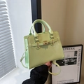 Elegant mint green crossbody bag with gold rotating lock and top handle in matte leather - Green