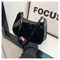 Chic black patent leather hobo bag with a glossy finish and minimalist baguette design - Black