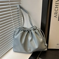 Light blue-grey pleated drawstring shoulder bag with a small metal bow and glossy finish - Blue