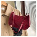 Chic red patent leather hobo bag with adjustable strap and sleek metallic zipper detail - Red