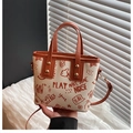 Chic cream tote bag with brown handles and stylish street style graffiti patterns - Brown