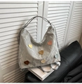 Silver wrinkled tote bag featuring colorful heart patches on a sleek metal texture - Silver