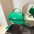 Bright green quilted crossbody bag with gold buckle and adjustable long shoulder strap - Green
