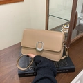 Minimalist apricot flap crossbody bag with silver oval metal buckle and slim shoulder strap - Khaki