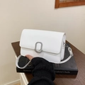 Minimalist white square flap shoulder bag with silver oval buckle on black book - White
