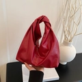 Chic red faux leather hobo bag with unique knotted handle for a stylish look - Red