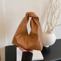 Chic brown minimalist tote bag with unique knotted handle design made of premium PU leather - Khaki