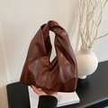 Minimalist dark brown soft leather hobo bag with a unique knot handle design - Brown
