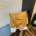 Khaki PU leather tote bag featuring a bow accent and silver chain strap for women - Khaki