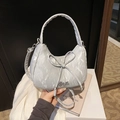 Silver bow knot crescent bag in wrinkled faux leather with a chic metal logo accent - Silver