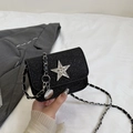 Elegant black glitter mini crossbody bag with a silver rhinestone star and chain strap - Black