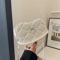 Mini heart-shaped quilted bag in white faux leather with pearl chain and bow detail - White