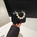 Girls' black crossbody handbag with heart quilting and elegant pearl top handle strap - Black