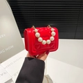 Red heart-quilted girls mini bag with faux pearl handle and gold chain strap - Red