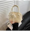 Chic beige shell handbag with lace bow and pearl charm for elegant women - With Pendant / White