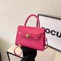 Piccola borsa a mano color magenta con fiocco e chiusura a girello in metallo dorato - Rosa Rosso