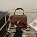 Chic chocolate brown trapezoid crossbody bag with gold metal lock and leather strap - Brown