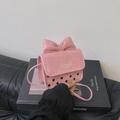 Rosa Mini-Umhängetasche mit großer Schleife und schwarzen Polka-Dot-Musterdetails - Rosa