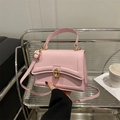 Pink minimalist crossbody bag with gold buckle and stylish textured leather for women - Pink