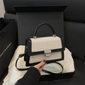 Chic beige woven mini square bag with black leather trim and metal lock closure - White