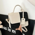 Fashionable black and white color-block crossbody bag with textured top handle for women - Black