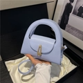 Mini light blue leather handbag with gold geometric clasp and a slim shoulder strap - Blue