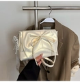 Pearlescent white bow crossbody bag with elegant pearl and lace charm accessories - Pearlescent Yellow