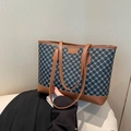 Bolso tote gris oscuro con diseño vintage, asas de cuero marrón y detalle de etiqueta - Negro