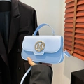 Light blue vintage leather handbag with gold M logo buckle and single top handle - Blue