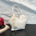 White quilted tote bag with colorful wavy stitching and letter embossing detail - White