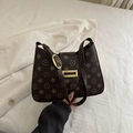 Klassieke donkerbruine crossbodytas met vintage bloemenmonogram en gouden gesp - Donkerbruin