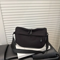 Water-resistant black nylon half-moon crossbody bag with adjustable strap and dual zippers - Black
