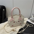 Chic cream-white crossbody bag with cute cat print and pink handles for women - White
