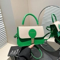 Green leather and beige woven patchwork handbag with gold clasp and top handle - Green