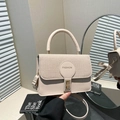 Chic beige crossbody bag featuring textured fabric patchwork and a golden metal twist lock - Khaki