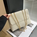 Chic cream woven flap shoulder bag with gold chain strap for stylish daily commuting - Off White