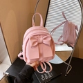 Mini sac à dos rose pour femme avec grand nœud décoratif et texture en cuir synthétique - Rose