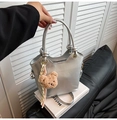 Silver metallic top handle bucket bag with plush bear charm and striped ribbon detail - With Pendant / Silver