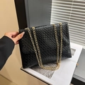 Classic black woven crossbody bag with gold chain strap in a stylish structured design - Black