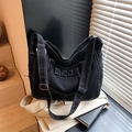 Large black denim tote bag with white contrast stitching and frayed edge details - Black