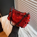Fashionable red sequin shoulder bag with black strap and shiny texture finish - Red